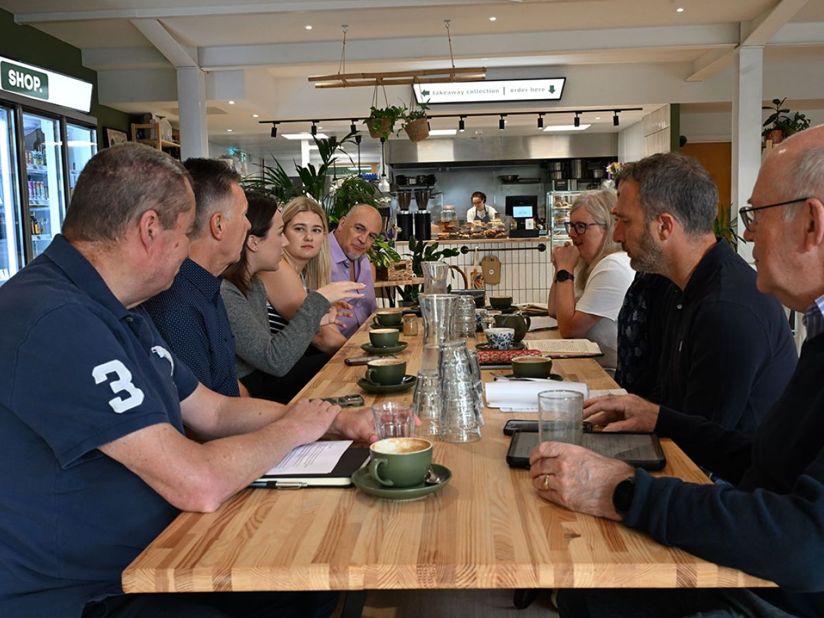 group meeting  around long tabel at networking event
